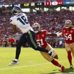 
              Seattle Seahawks wide receiver Freddie Swain (18) catches a touchdown pass against San Francisco 49ers linebacker Azeez Al-Shaair (51) during the second half of an NFL football game in Santa Clara, Calif., Sunday, Oct. 3, 2021. (AP Photo/Jed Jacobsohn)
            
