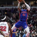 
              Detroit Pistons forward Saddiq Bey (41) shoots as Chicago Bulls forward Alize Johnson (22) looks on during the first half of an NBA basketball game in Chicago, Saturday, Oct. 23, 2021. (AP Photo/Nam Y. Huh)
            