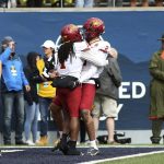 
              Iowa State wide receivers Tarique Milton (1) and Sean Shaw Jr. (2) celebrate after Milton scores a touchdown against West Virginia during the first half of an NCAA college football game in Morgantown, W.Va., Saturday, Oct. 30, 2021. (AP Photo/Kathleen Batten)
            