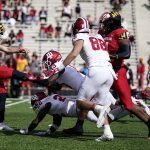 
              A punt by Maryland punter Anthony Pecorella, left, is blocked by Indiana's Miles Marshall (13) during the first half of an NCAA college football game, Saturday, Oct. 30, 2021, in College Park, Md. (AP Photo/Julio Cortez)
            