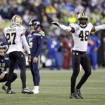 
              New Orleans Saints' J.T. Gray (48) signals "no good" on a field goal-attempt of Seattle Seahawks' Jason Myers (5) during the second half of an NFL football game, Monday, Oct. 25, 2021, in Seattle. (AP Photo/John Froschauer)
            