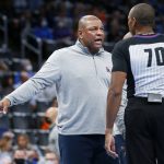 
              Philadelphia 76ers head coach Doc Rivers, left, talks to official Phenizee Ransom (70) in the first half of an NBA basketball game against the Oklahoma Thunder, Sunday, Oct. 24, 2021, in Oklahoma City. (AP Photo/Nate Billings)
            