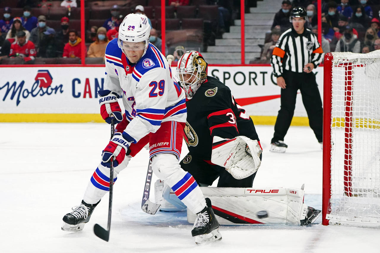 New York Rangers left wing Dryden Hunt (29) fails to deflect a shot on Ottawa Senators goaltender M...