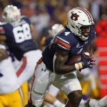 
              Auburn running back Tank Bigsby (4) carries in the first half of an NCAA college football game against LSU in Baton Rouge, La., Saturday, Oct. 2, 2021. (AP Photo/Gerald Herbert)
            