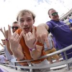 
              Texas and TCU fans let their feelings show during the second half of an NCAA college football game Saturday, Oct. 2, 2021, in Fort Worth, Texas. Texas won 32-27. (AP Photo/Ron Jenkins)
            