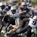 
              Navy fullback Isaac Ruoss runs with the ball against UCF during the first half of an NCAA college football game, Saturday, Oct. 2, 2021, in Annapolis, Md. (AP Photo/Julio Cortez)
            