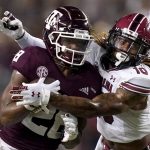 
              Texas A&M running back Isaiah Spiller (28) is tackled by South Carolina defensive back R.J. Roderick (10) after a short run during the first quarter of an NCAA college football game on Saturday, Oct. 23, 2021, in College Station, Texas. (AP Photo/Sam Craft)
            