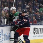 
              Dallas Stars' Joe Pavelski, left, and Columbus Blue Jackets' Vladislav Gavrikov fight for the puck during the first period of an NHL hockey game Monday, Oct. 25, 2021, in Columbus, Ohio. (AP Photo/Jay LaPrete)
            