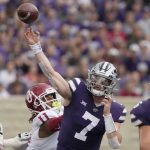
              Kansas State quarterback Skylar Thompson (7) passes under pressure from Oklahoma linebacker Nik Bonitto (11) during the first half of an NCAA college football game in Manhattan, Kan., Saturday, Oct. 2 2021. (AP Photo/Orlin Wagner)
            