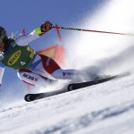 
              Switzerland's Lara Gut-Behrami speeds down the course during an alpine ski, women's World Cup giant slalom, in Soelden, Austria, Saturday, Oct. 23, 2021. (AP Photo/Marco Trovati)
            