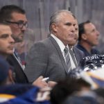 
              St. Louis Blues coach Craig Berube is seen on the bench during the third period of an NHL hockey game between the St. Louis Blues and the Los Angeles Kings Monday, Oct. 25, 2021, in St. Louis. (AP Photo/Jeff Roberson)
            
