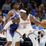 
              Oklahoma City Thunder forward Luguentz Dort (5) works against Philadelphia 76ers guard Tyrese Maxey, left, in the first half of an NBA basketball game Sunday, Oct. 24, 2021, in Oklahoma City. (AP Photo/Nate Billings)
            