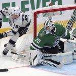 
              Los Angeles Kings left wing Carl Grundstrom (91) tries to shoot on Dallas Stars goaltender Braden Holtby (70) during the second period of an NHL hockey game Friday, Oct. 22, 2021, in Dallas. (AP Photo/Richard W. Rodriguez)
            