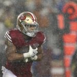 
              Rain falls as San Francisco 49ers running back Elijah Mitchell runs against the Indianapolis Colts during the first half of an NFL football game in Santa Clara, Calif., Sunday, Oct. 24, 2021. (AP Photo/Jed Jacobsohn)
            