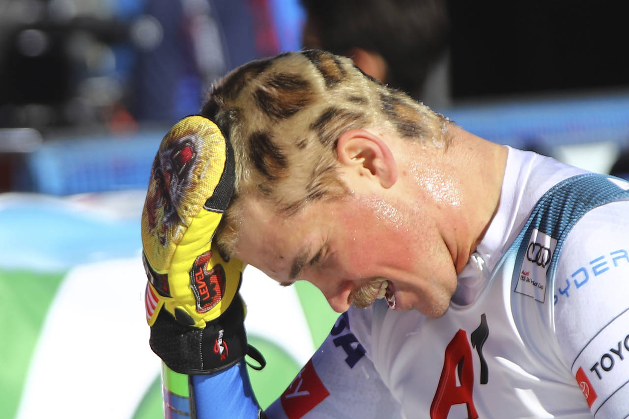 United States' River Radamus gestures after crossing the finish line during an alpine ski, men's Wo...
