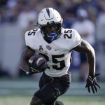 
              UCF running back Johnny Richardson runs with the ball against Navy during the first half of an NCAA college football game, Saturday, Oct. 2, 2021, in Annapolis, Md. (AP Photo/Julio Cortez)
            