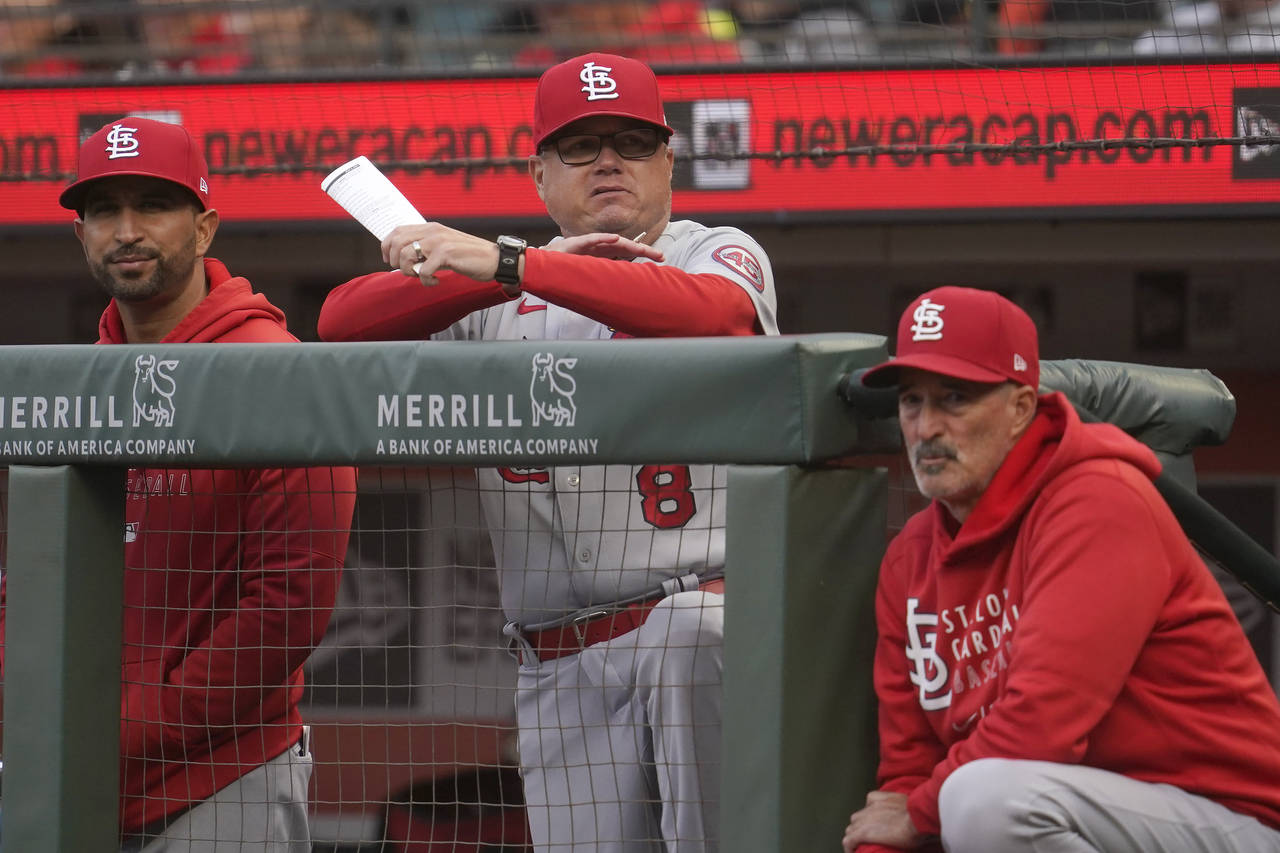 FILE - St. Louis Cardinals manager Mike Shildt, middle, is shownduring a baseball game against the ...
