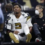 
              New Orleans Saints quarterback Jameis Winston (2) is carted off the field after being injured from a horse collar tackle in the first half of an NFL football game against the Tampa Bay Buccaneers in New Orleans, Sunday, Oct. 31, 2021. (AP Photo/Derick Hingle)
            