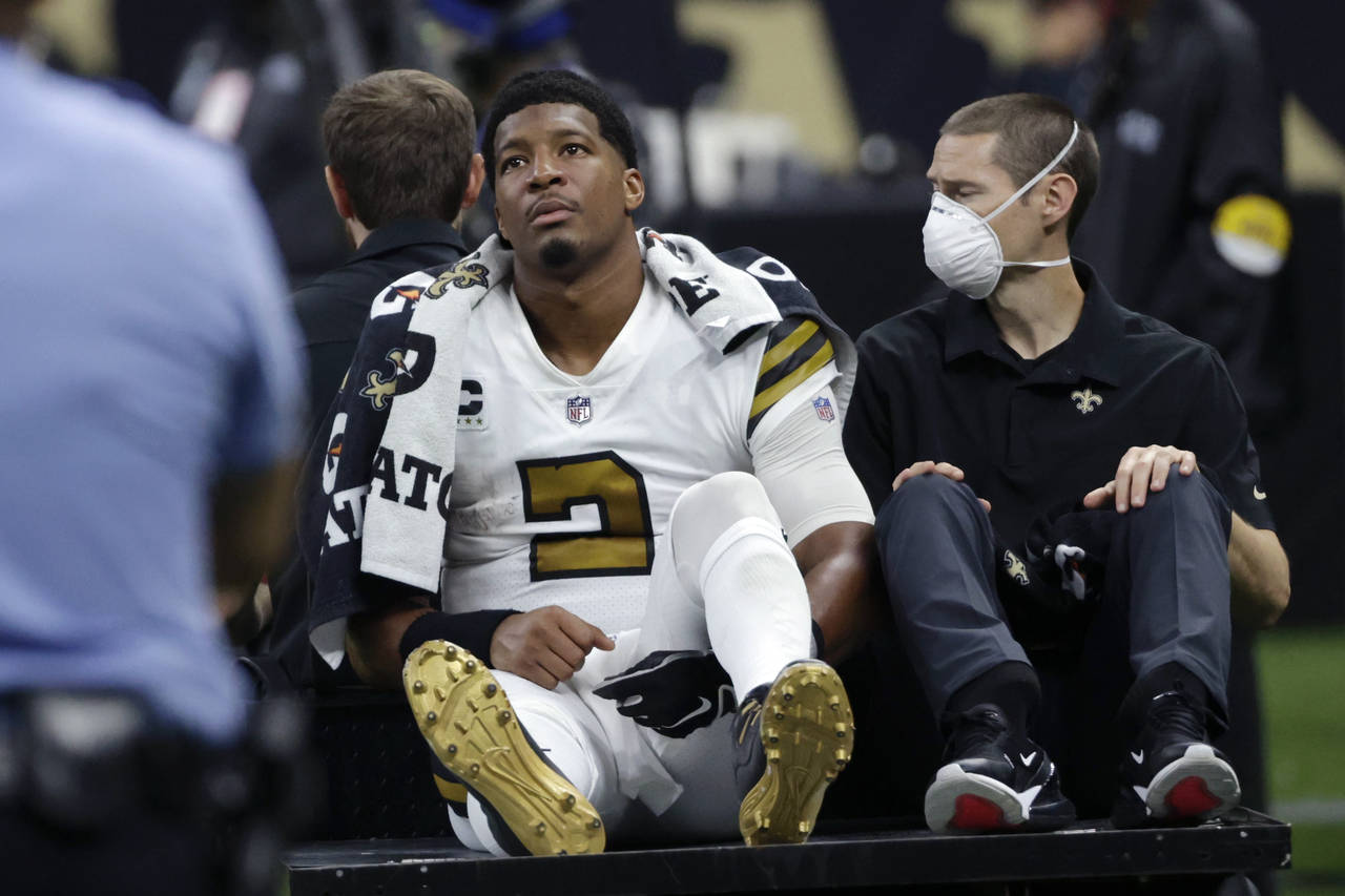 New Orleans Saints quarterback Jameis Winston (2) is carted off the field after being injured from ...