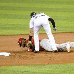 
              Philadelphia Phillies' Odubel Herrera, bottom, is tagged out at second base during the first inning of a baseball game against the Miami Marlins, Sunday, Oct. 3, 2021, in Miami. (AP Photo/Gaston De Cardenas)
            
