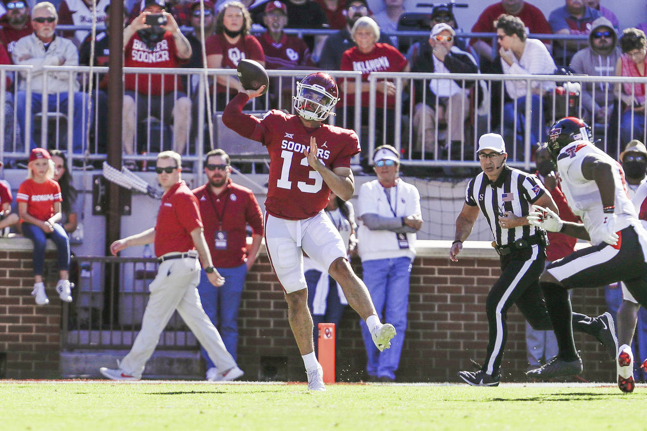 Oklahoma quarterback Caleb Williams (13) passes during the first half of an NCAA college football g...