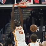 
              Atlanta Hawks' Clint Capela (15) dunks against the Cleveland Cavaliers in the first half of an NBA basketball game, Saturday, Oct. 23, 2021, in Cleveland. (AP Photo/Tony Dejak)
            