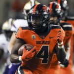 
              Oregon State running back B.J. Baylor (4) rushes for 27-yards to score a touchdown during the second half of an NCAA college football game against Washington on Saturday, Oct. 2, 2021, in Corvallis, Ore. Oregon State won 27-24. (AP Photo/Amanda Loman)
            
