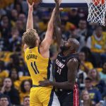 
              Miami Heat center Dewayne Dedmon (21) attempts to block a shot by Indiana Pacers forward Domantas Sabonis (11) during the first half of an NBA basketball game in Indianapolis, Saturday, Oct. 23, 2021. (AP Photo/Doug McSchooler)
            