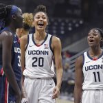 
              Connecticut's Piath Gabriel, left, Olivia Nelson-Ododa and Mir McLean, right, laugh during First Night events for the UConn men's and women's NCAA college basketball teams Friday, Oct. 15, 2021, in Storrs, Conn. (AP Photo/Jessica Hill)
            