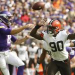 
              Cleveland Browns defensive end Jadeveon Clowney (90) pressures Minnesota Vikings quarterback Kirk Cousins (8) as he throws a pass during the first half of an NFL football game, Sunday, Oct. 3, 2021, in Minneapolis. (AP Photo/Bruce Kluckhohn)
            