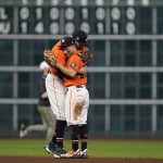 
              Houston Astros shortstop Carlos Correa and second baseman Jose Altuve hug after Game 2 of baseball's World Series between the Houston Astros and the Atlanta Braves Wednesday, Oct. 27, 2021, in Houston. The Astros won 7-2, to tie the series 1-1. (AP Photo/David J. Phillip)
            