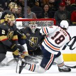
              Edmonton Oilers left wing Zach Hyman (18) scores past Vegas Golden Knights goaltender Robin Lehner (90) during the second period of an NHL hockey game Friday, Oct. 22, 2021, in Las Vegas. Vegas Golden Knights defenseman Zach Whitecloud (2) looks on. (AP Photo/Steve Marcus)
            