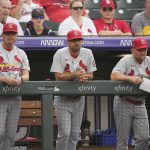 
              FILE - St. Louis Cardinals manager Mike Shildt, bench coach Oliver Marmol and first base coach Stubby Clapp, from left, watch from the dugout in the first inning of the team's baseball game against the Colorado Rockies oin Denver, in this Friday, July 2, 2021, file photo. The Cardinals plan to announce Monday, Oct. 25, 2021, that bench coach Oliver Marmol will be promoted to replace fired manager Mike Shildt, according to a person familiar with the decision. The person spoke to The Associated Press on condition of anonymity Sunday night because the team hadn't revealed the hiring publicy. (AP Photo/David Zalubowski, File)
            