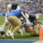 
              Oregon running back Travis Dye is stopped just short of the goal line during the first half of an NCAA college football game against UCLA, Saturday, Oct. 23, 2021, in Pasadena, Calif. (AP Photo/Marcio Jose Sanchez)
            