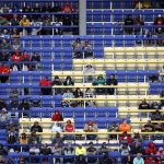 
              Fans watch from the grandstand during a NASCAR Cup Series auto race at Kansas Speedway in Kansas City, Kan., Sunday, Oct. 24, 2021. (AP Photo/Colin E. Braley)
            