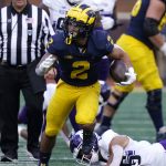 
              Michigan running back Blake Corum rushes during the second half of an NCAA college football game against Northwestern, Saturday, Oct. 23, 2021, in Ann Arbor, Mich. (AP Photo/Carlos Osorio)
            
