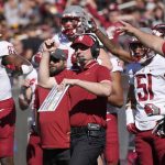 
              Washington State acting head coach Jake Dickert and his team celebrate a missed field goal by Arizona State during the first half of an NCAA college football game, Saturday, Oct 30, 2021, in Tempe, Ariz. (AP Photo/Darryl Webb)
            