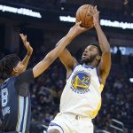 
              Golden State Warriors forward Andrew Wiggins (22) shoots against Memphis Grizzlies guard Ziaire Williams (8) during the first half of an NBA basketball game in San Francisco, Thursday, Oct. 28, 2021. (AP Photo/Jeff Chiu)
            
