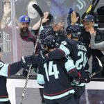 
              Seattle Kraken players celebrate after Haydn Fleury scored against the Minnesota Wild during the second period of an NHL hockey game, Thursday, Oct. 28, 2021, in Seattle. (AP Photo/Ted S. Warren)
            