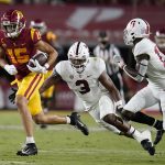 
              Southern California wide receiver Drake London (15) runs past Stanford linebacker Levani Damuni (3) during the first half of an NCAA college football game Saturday, Sept. 11, 2021, in Los Angeles. (AP Photo/Marcio Jose Sanchez)
            