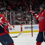 
              Washington Capitals center Evgeny Kuznetsov, left, celebrates his goal with left wing Alex Ovechkin in the second period of an NHL hockey game against the Detroit Red Wings, Wednesday, Oct. 27, 2021, in Washington. (AP Photo/Alex Brandon)
            