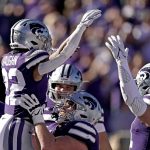 
              Kansas State running back Deuce Vaughn (22) celebrates with teammates after scoring a touchdown during the first half of an NCAA college football game against TCU, Saturday, Oct. 30, 2021, in Manhattan, Kan. (AP Photo/Charlie Riedel)
            