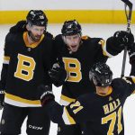 
              Boston Bruins' Charlie Coyle (13) celebrates his goal with teammates Derek Forbort (28) and Taylor Hall (71) during the first period of an NHL hockey game against the Florida Panthers, Saturday, Oct. 30, 2021, in Boston. (AP Photo/Michael Dwyer)
            