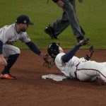 
              Atlanta Braves' Austin Riley is safe at second past Houston Astros second baseman Jose Altuve after a double during the sixth inning in Game 4 of baseball's World Series between the Houston Astros and the Atlanta Braves Saturday, Oct. 30, 2021, in Atlanta. (AP Photo/John Bazemore)
            