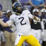 
              West Virginia quarterback Jarret Doege (2) throws against TCU during the first half of an NCAA college football game Saturday, Oct. 23, 2021, in Fort Worth, Texas. (AP Photo/Ron Jenkins)
            