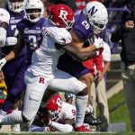 
              Northwestern running back Evan Hull (26) is tackled by Rutgers linebacker Olakunle Fatukasi during the first half of an NCAA college football game in Evanston, Ill., Saturday, Oct. 16, 2021. (AP Photo/Nam Y. Huh)
            