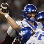 
              Kentucky quarterback Will Levis (7) passes while in traffic against Mississippi State during the first half of an NCAA college football game in Starkville, Miss., Saturday, Oct. 29, 2021. (AP Photo/Rogelio V. Solis)
            