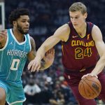 
              Cleveland Cavaliers' Lauri Markkanen (24) drives against Charlotte Hornets' Miles Bridges (0) in the first half of an NBA basketball game, Friday, Oct. 22, 2021, in Cleveland. (AP Photo/Tony Dejak)
            