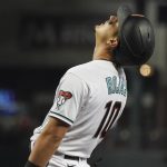 
              Arizona Diamondbacks' Josh Rojas reacts after striking out against the Colorado Rockies during the first inning of a baseball game Friday, Oct 1, 2021, in Phoenix. (AP Photo/Darryl Webb)
            
