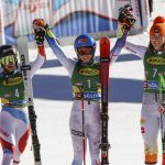 
              Winner United States' Mikaela Shiffrin, center, is celebrates with second places Switzerland's Lara Gut-Behrami, left and third placed Slovakia's Petra Vlhova on the podium after an alpine ski, women's World Cup giant slalom, in Soelden, Austria, Saturday, Oct. 23, 2021. (AP Photo/Marco Trovati)
            
